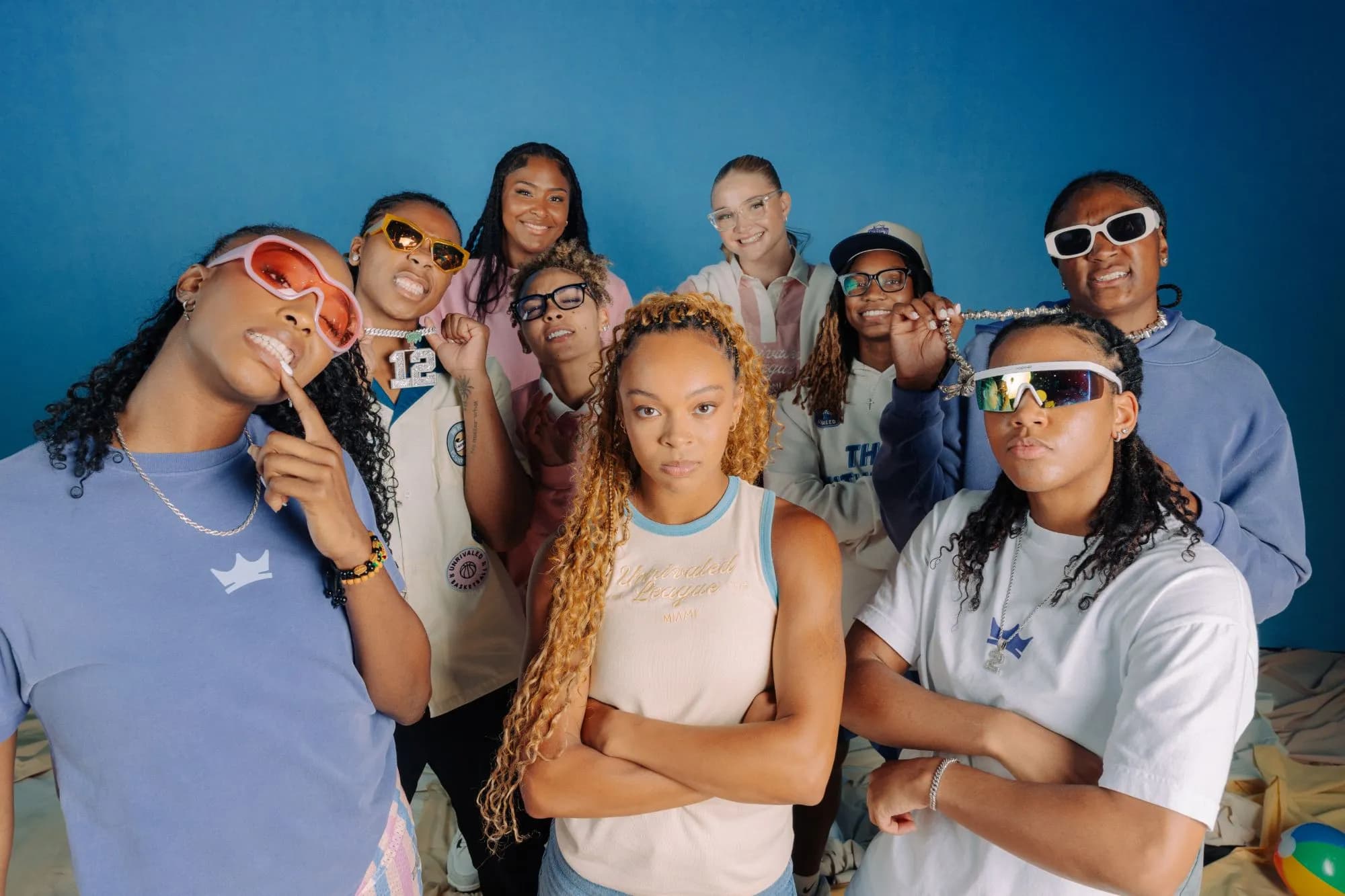 Nine players in Unrivaled gear against a blue backdrop